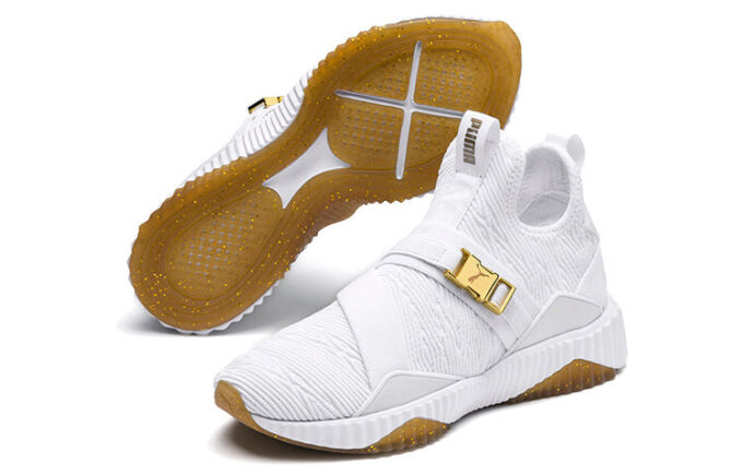 (Mujeres) Defy Varsity Mid “Blanco Dorado Metálico”