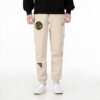 Pantalón deportivo de punto con insignia mixta “Beige”