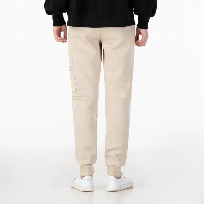 Pantalón deportivo de punto con insignia mixta “Beige”