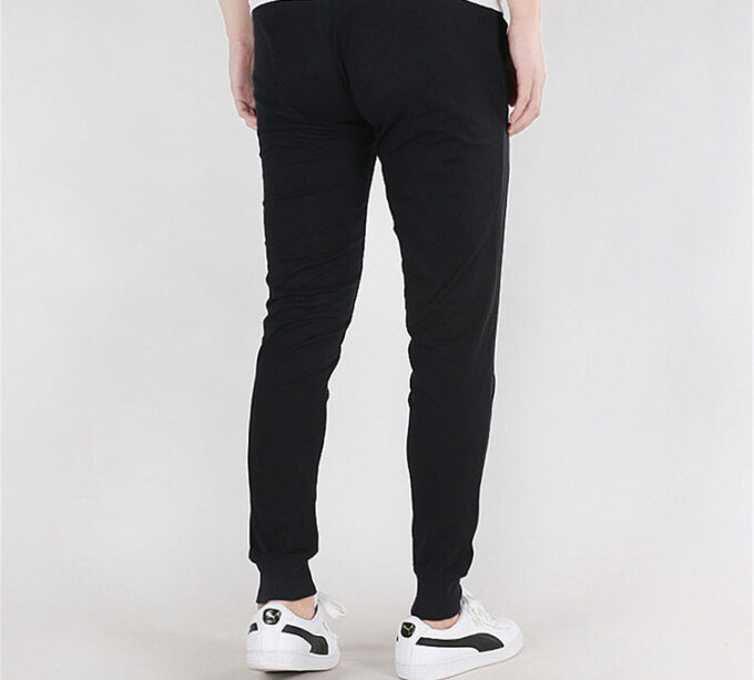 Pantalones clásicos de jersey con puños en blanco y negro
