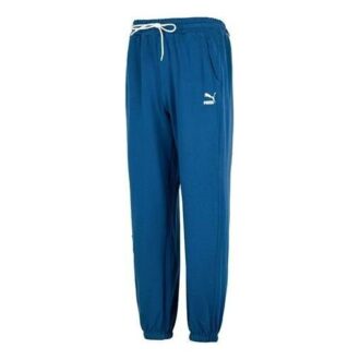 Pantalones deportivos con el logo del equipo en azul