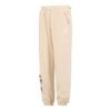 Pantalones deportivos con insignia del equipo en color beige