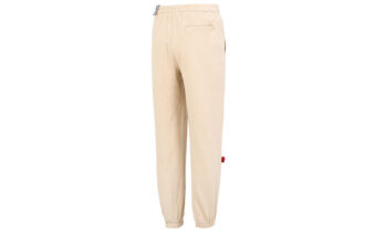 Pantalones deportivos con insignia del equipo en color beige