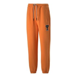 Pantalones deportivos PUMA x Ami “Naranja”