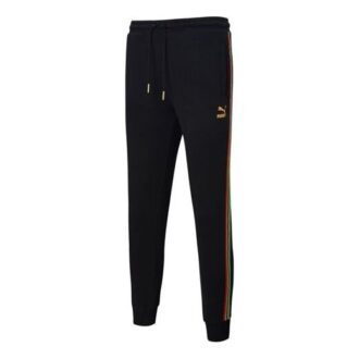 Pantalones deportivos Unity de Tailored For Sport “Negro Naranja”
