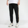 Pantalones deportivos Unity de Tailored For Sport “Negro Naranja”