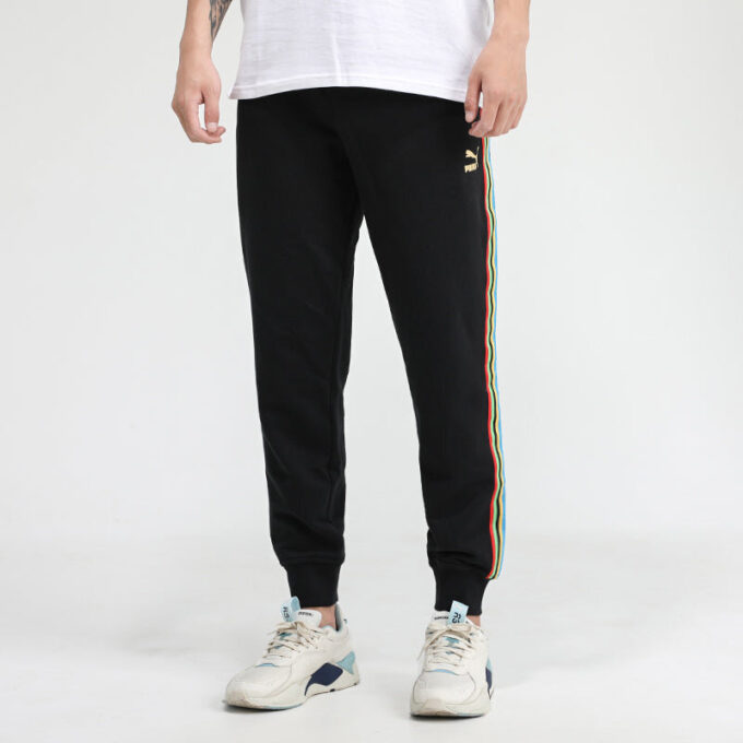 Pantalones deportivos Unity de Tailored For Sport “Negro Naranja”