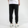 Pantalones deportivos Unity de Tailored For Sport “Negro Naranja”