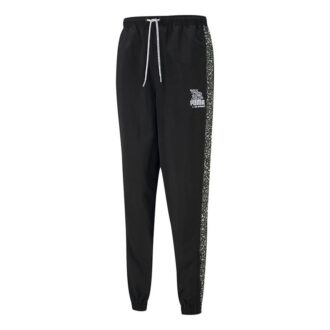 Pantalones largos deportivos con cordón tejido y grafiti Crossover de PUMA x Mr Doodle, color negro