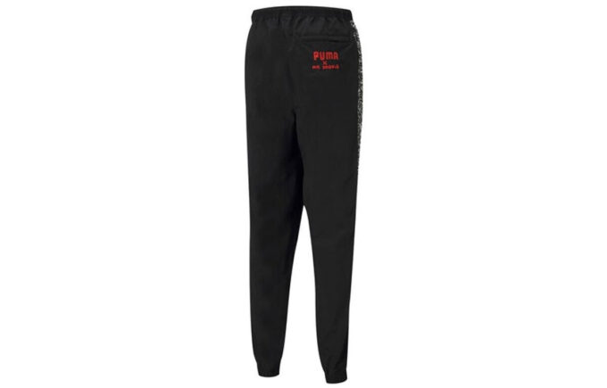 Pantalones largos deportivos con cordón tejido y grafiti Crossover de PUMA x Mr Doodle, color negro