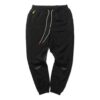 Pantalones tejidos PUMA x Randomevent “Negro”