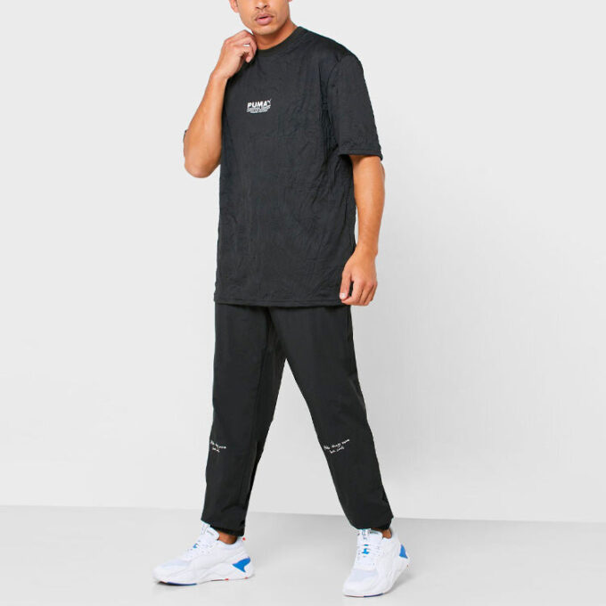Pantalones tejidos PUMA x Randomevent “Negro”