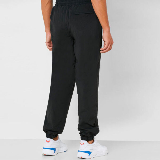 Pantalones tejidos PUMA x Randomevent “Negro”