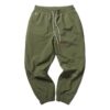 Pantalones tejidos PUMA x Randomevent “Verde”