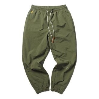 Pantalones tejidos PUMA x Randomevent “Verde”