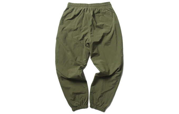 Pantalones tejidos PUMA x Randomevent “Verde”