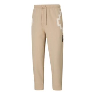 Pantalones unisex PUMA x PRONOUNCE 7/8 con estampado de encaje y corte capri en color caqui