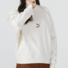 (WMNS) Camiseta de cuello redondo con media cremallera Das CC Graphic “Blanca”