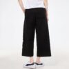 (WMNS) Pantalones casuales de punto con estampado de logotipo en negro